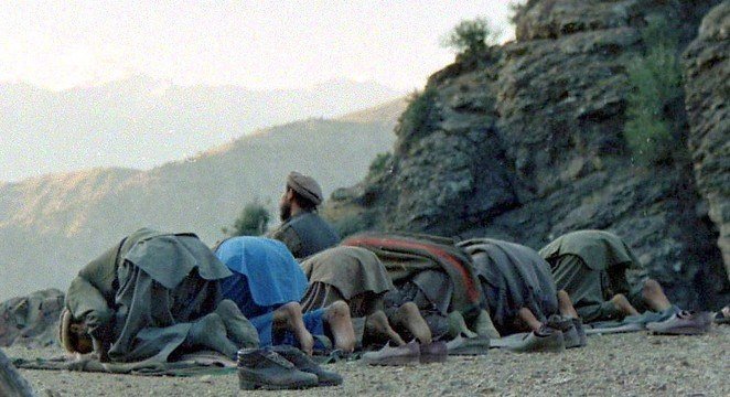 AFGHAN MUJHAIDEENS ARE OFFERING PRAYERS DURING WAR TIME