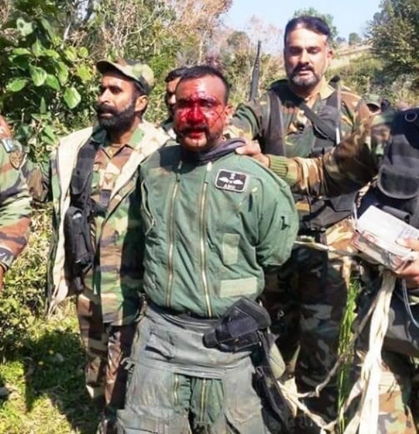 Bloody faced indian captured pilot
