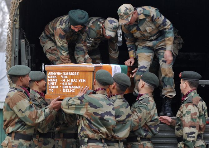 filthy indian soldiers carry a coffin of their filthy soldier which was killed by the PAKISTAN ARMY firing along LoC