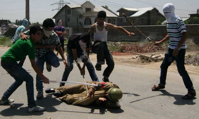 A Filthy indian Security Force Personnel Getting the Treatment from Brave Kashmiris