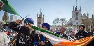 Sikhs Cutting filthy indian flag in uk