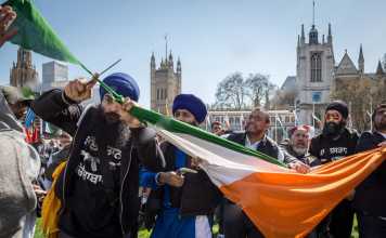 Sikhs Cutting filthy indian flag in uk