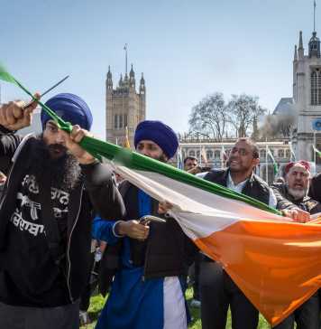 Sikhs Cutting filthy indian flag in uk