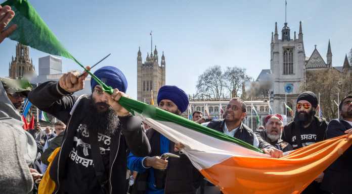 Sikhs Cutting filthy indian flag in uk
