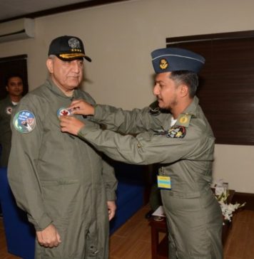 WING COMMANDER NAUMAN AKRAM PLACING BADGE TO COAS GENERAL BAJWA
