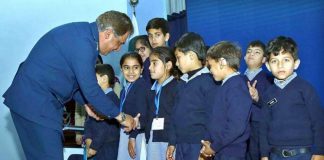 Air Marshal Aasim Azheer Interacting with Physically Challenged Kids During the Conference