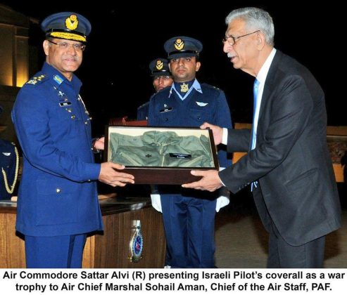PAF ACE Pilot Flt Lieutenant Sattar Alvi presenting War Trophy to the the CHIEF OF AIR STAFF (CAS) Air Chief Marshal Sohail Aman