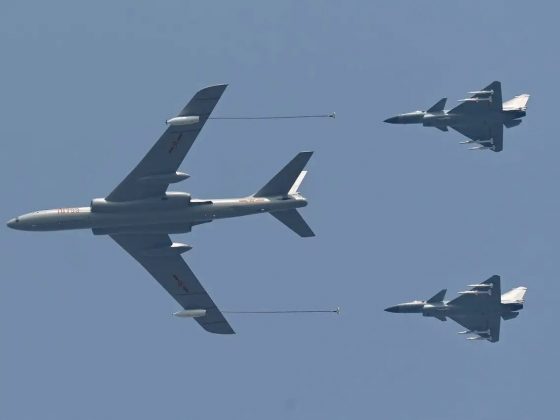 CHINESE H-6N Long-Range Heavyweight Bomber with CHINESE Fighter Jets in the Air