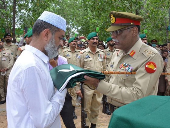 Corps Commander Rawalpindi Corps Lieutenant General Sahir Shamshad Mirza presented a Sacred National Flag of Sacred Country PAKISTAN to Major Talha Manan’s Father